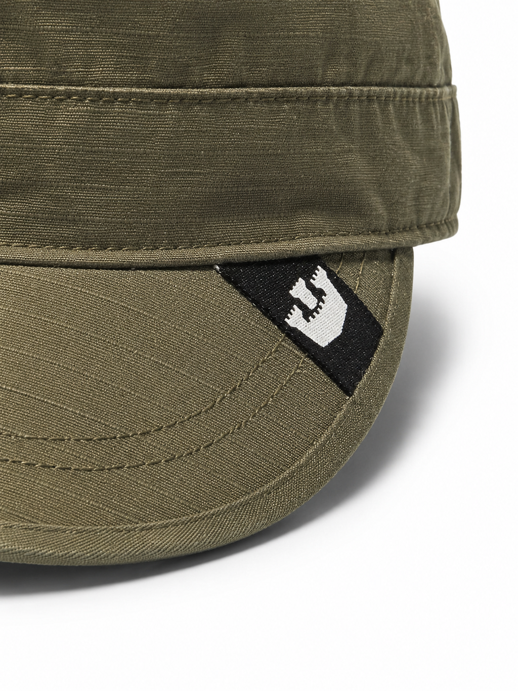 Front view of hat in 100% cotton showing the panel construction and archive detailing