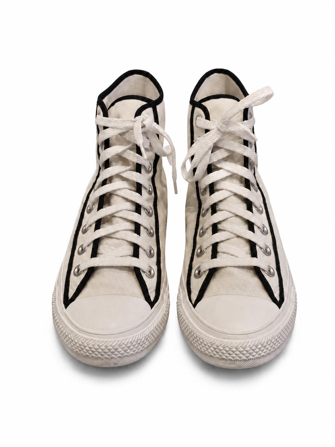 Front view of shoes in canvas showing the sole unit and upper silhouette