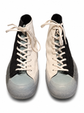Pair of high-top sneakers with black and white design on a white background