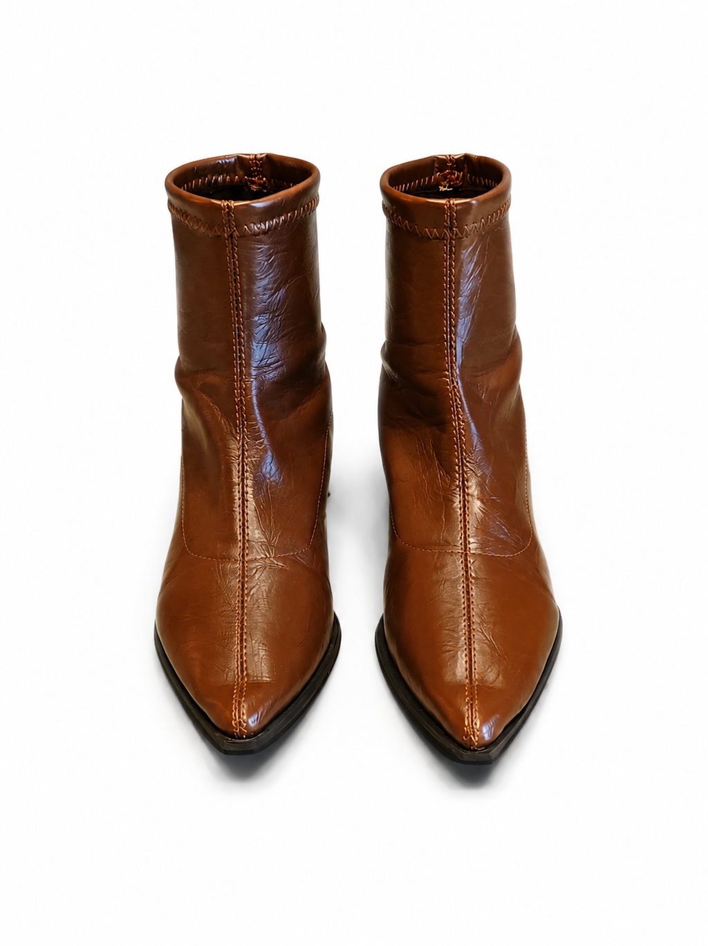 Front view of shoes in vegan leather boots in brown showing the sole unit and upper silhouette