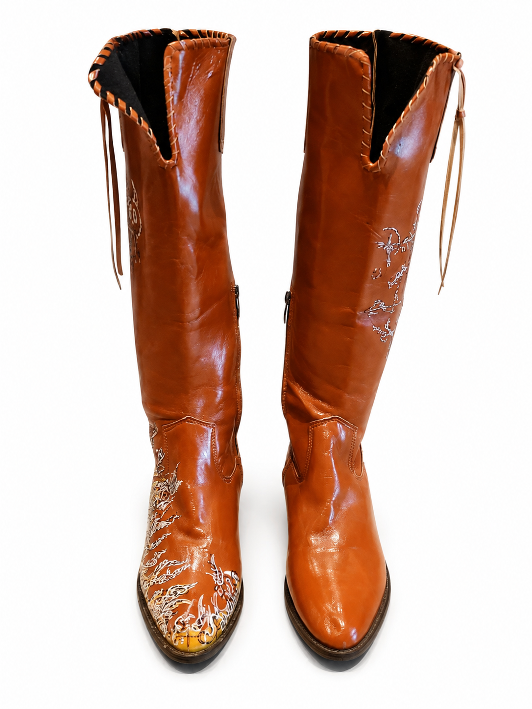 Front view of shoes in vegan leather cowboy boots showing the sole unit and upper silhouette