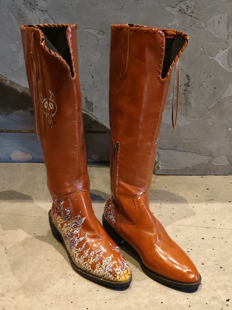 Front view of shoes in vegan leather cowboy boots showing the sole unit and upper silhouette
