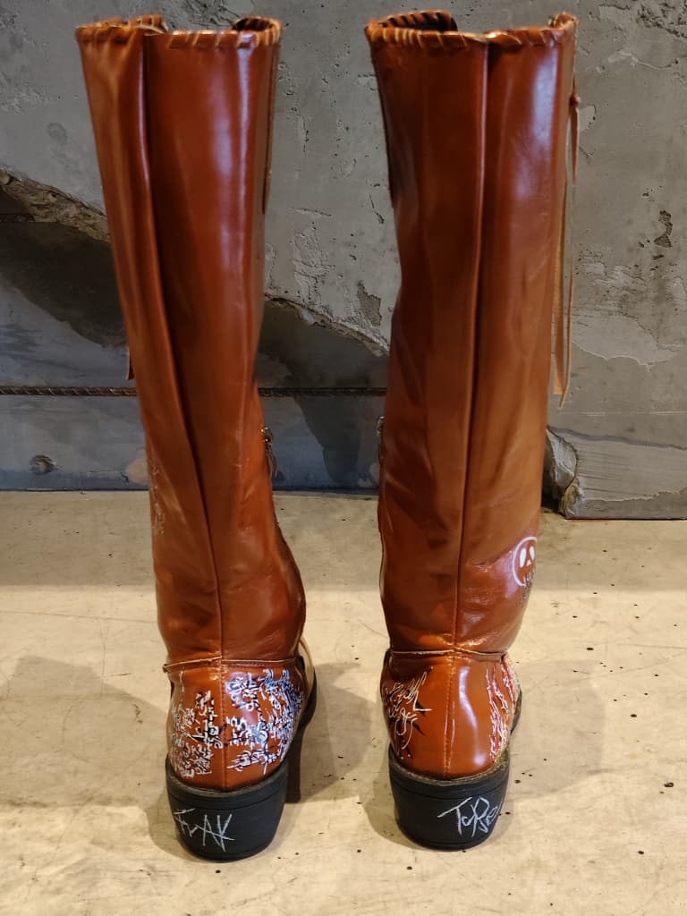 Front view of shoes in vegan leather cowboy boots showing the sole unit and upper silhouette