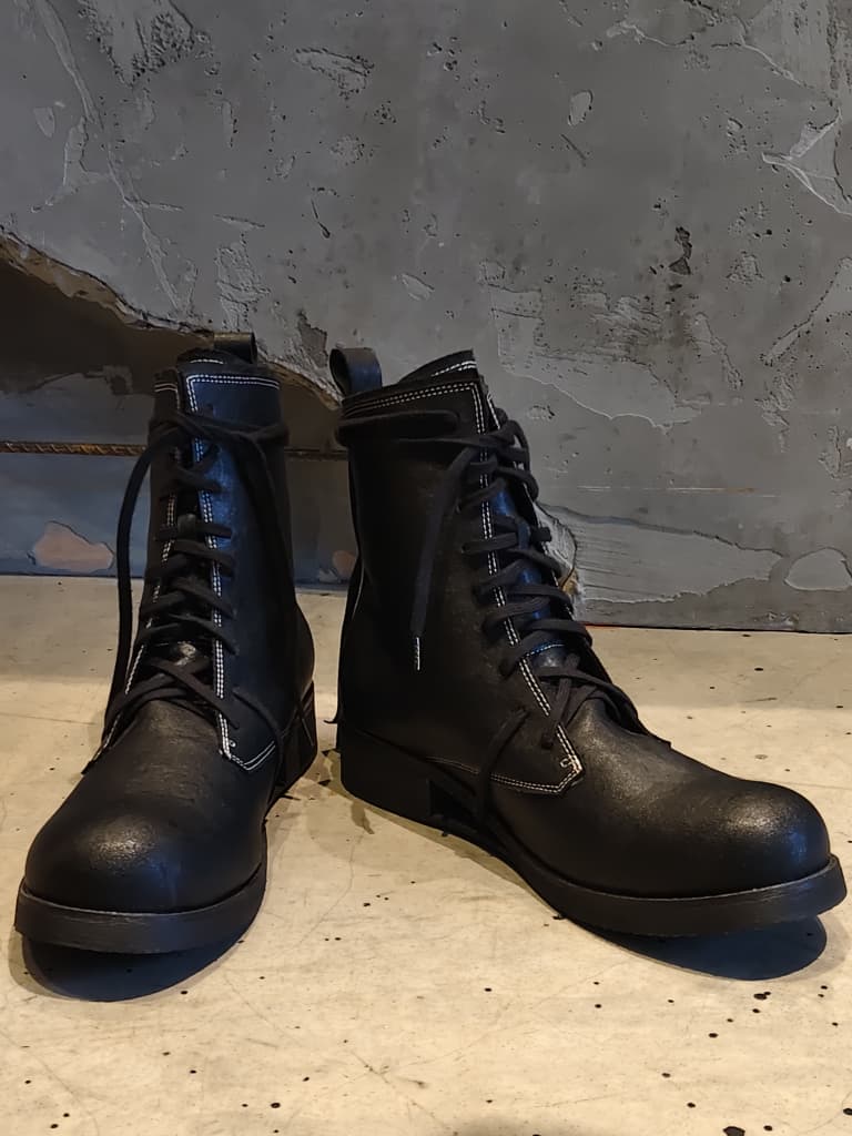 Front view of shoes in vegan leather showing the sole unit and upper silhouette