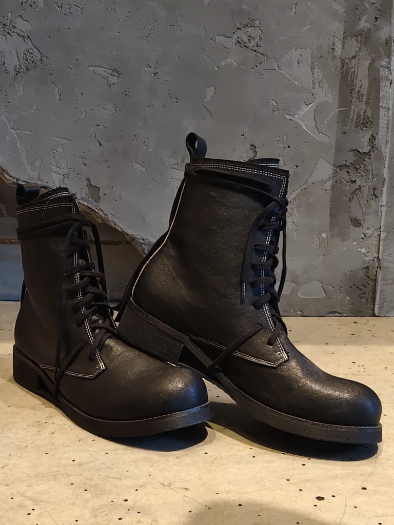 Front view of shoes in vegan leather showing the sole unit and upper silhouette
