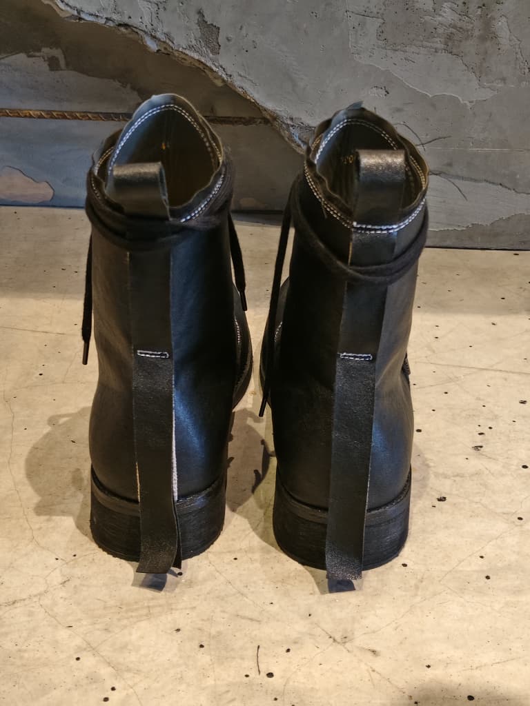 Front view of shoes in vegan leather showing the sole unit and upper silhouette