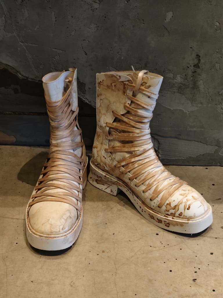 Front view of shoes in vegan leather showing the sole unit and upper silhouette