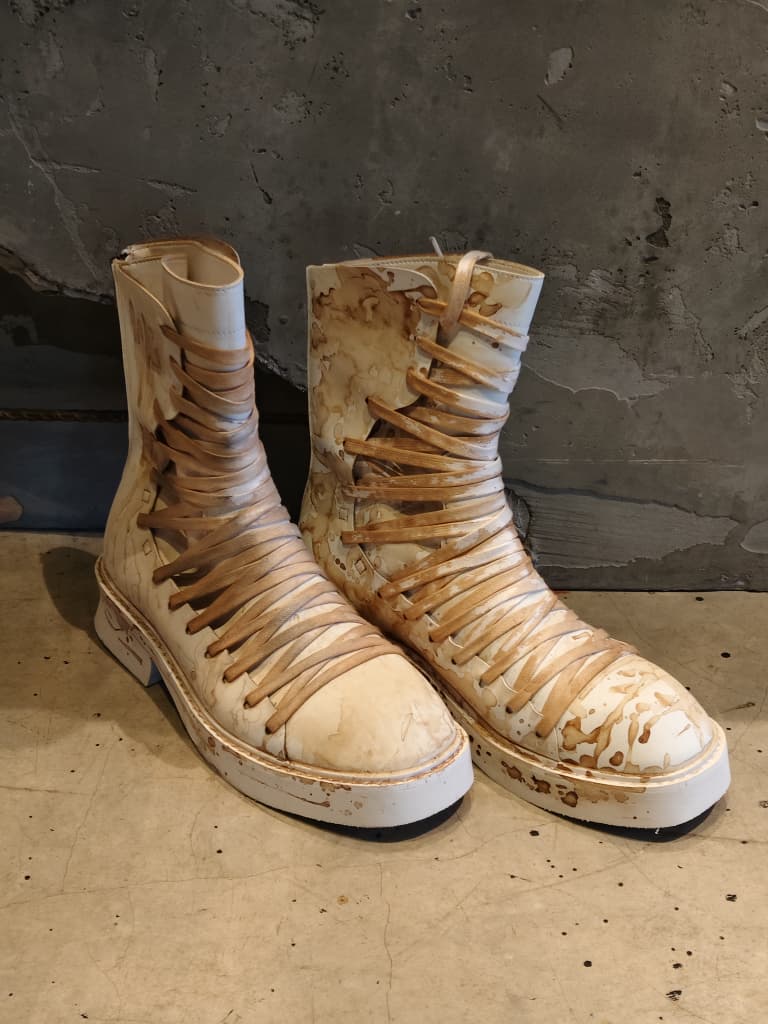 Front view of shoes in vegan leather showing the sole unit and upper silhouette