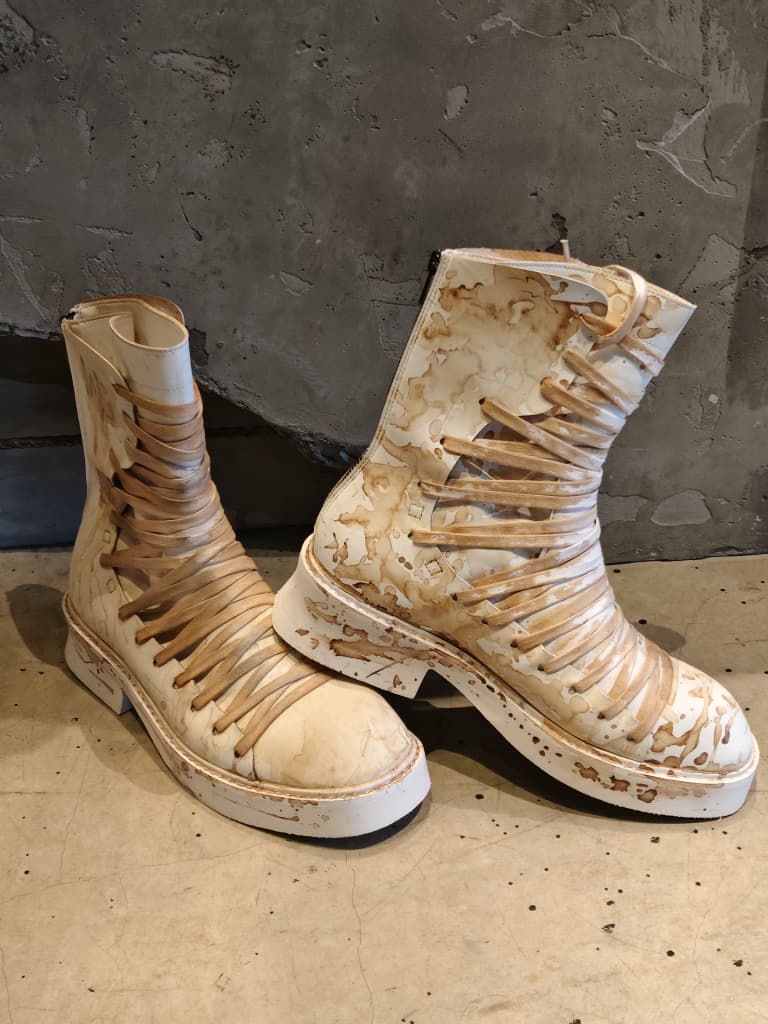 Front view of shoes in vegan leather showing the sole unit and upper silhouette