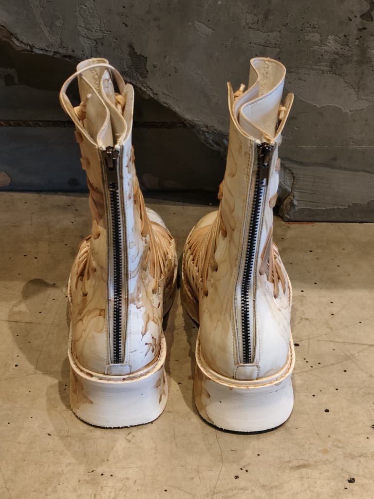 Front view of shoes in vegan leather showing the sole unit and upper silhouette
