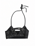 Black harness bralette back view showing eyelet trim and tie-cord detail