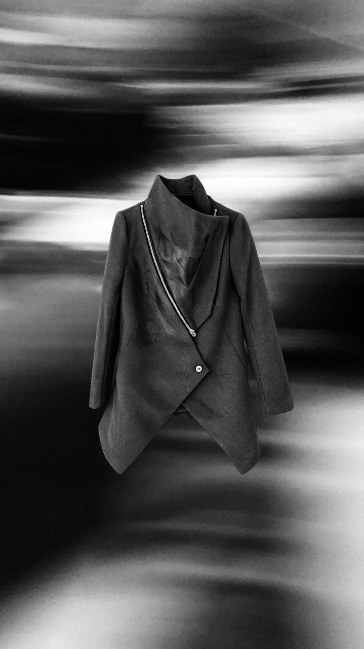 Dark wool coat with diagonal zip detail and architectural cut
