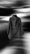 Dark wool coat with diagonal zip detail and architectural cut